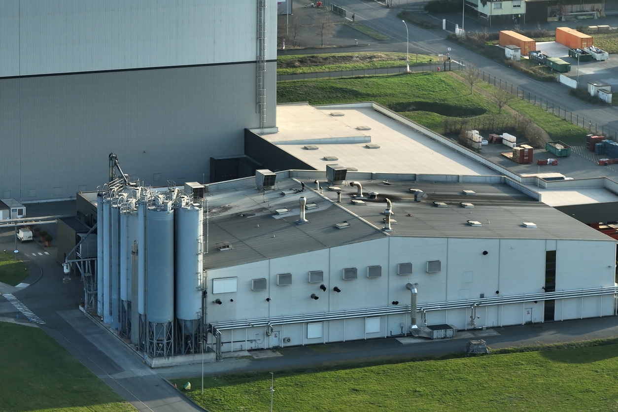 Aerial view of modern factory structure for production and distribution of industrial equipment Concept of global industry